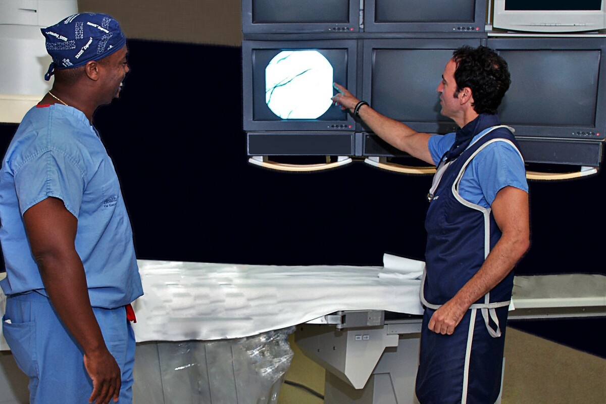 two people looking at screen in doctors office